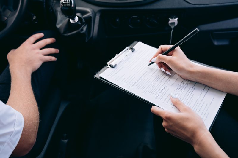 a driver and an auto insurance agent